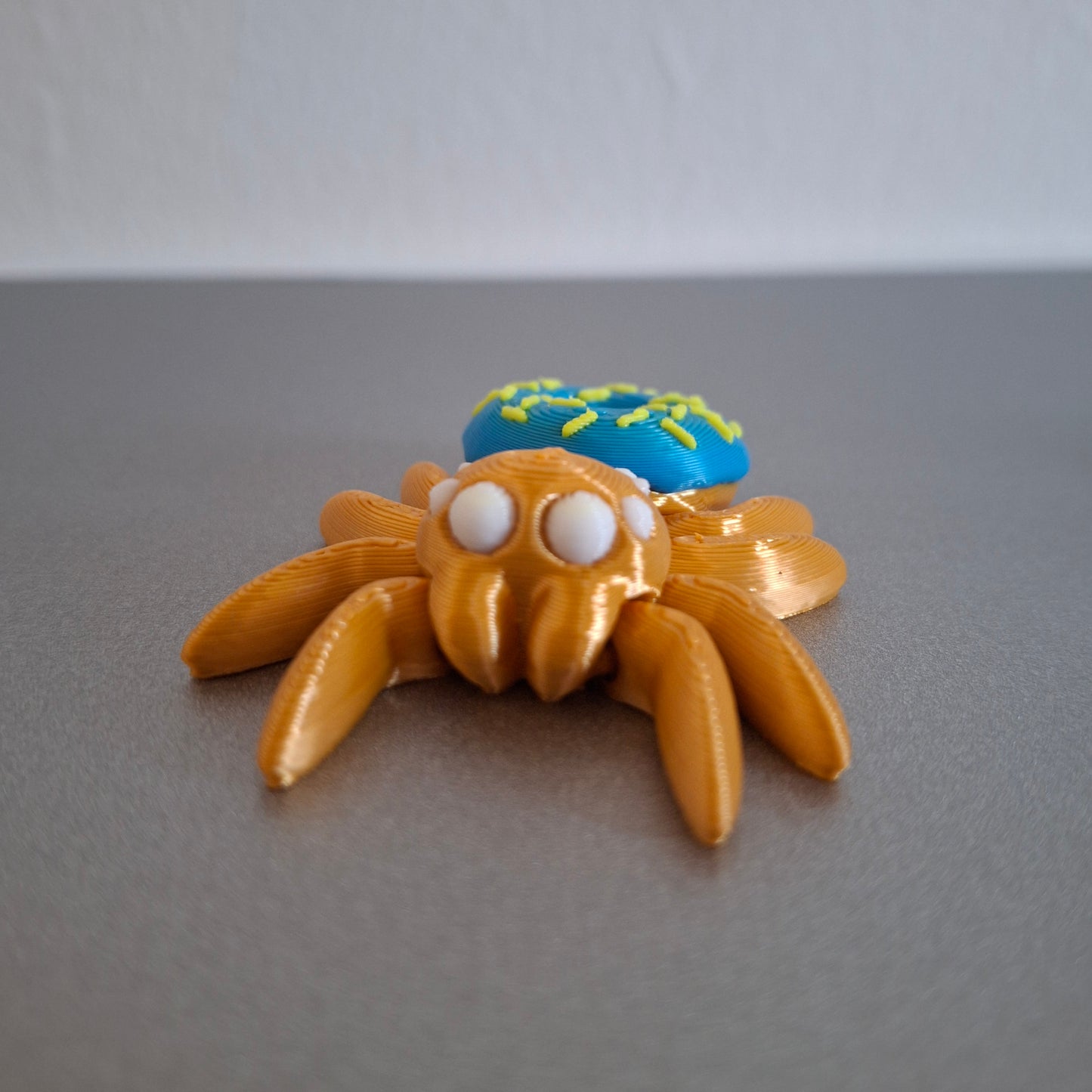 Mini Donut Edderkop - Blå, gul, hvid og guld