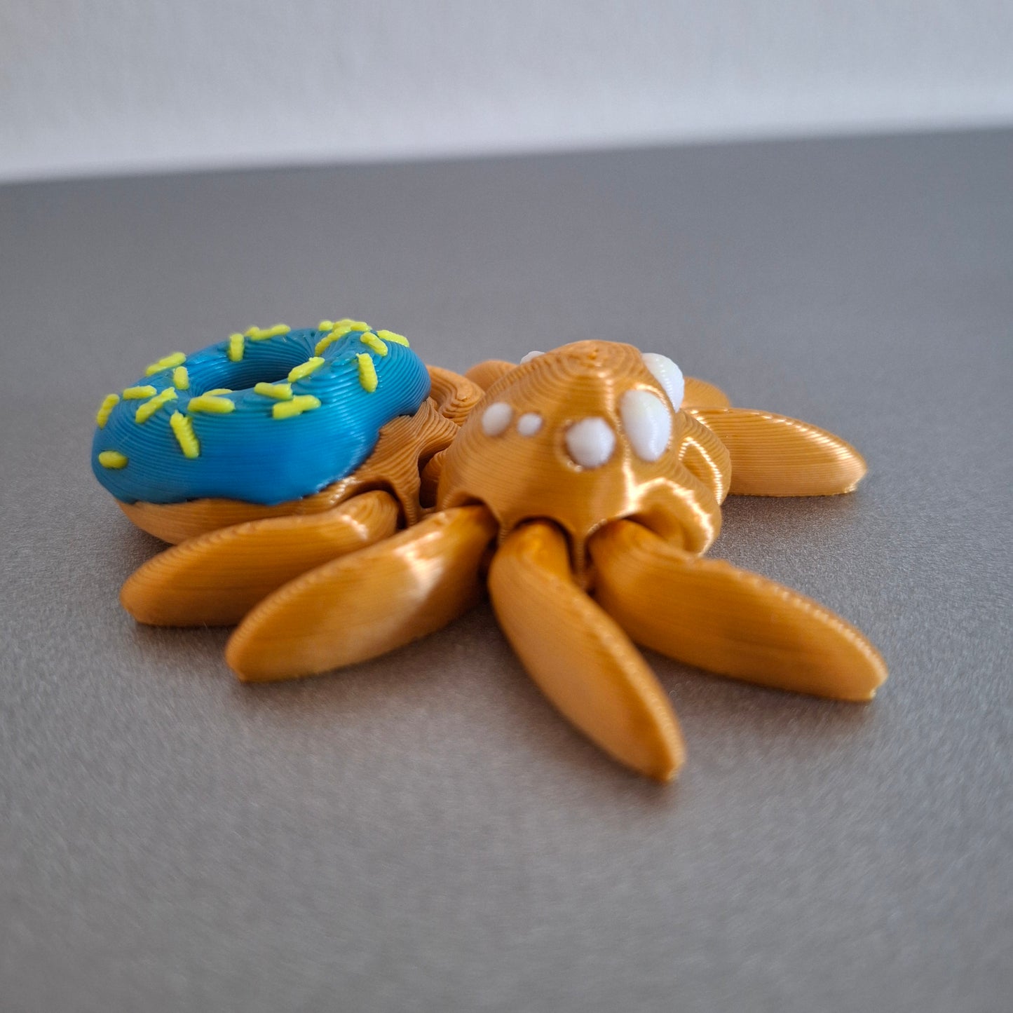 Mini Donut Edderkop - Blå, gul, hvid og guld